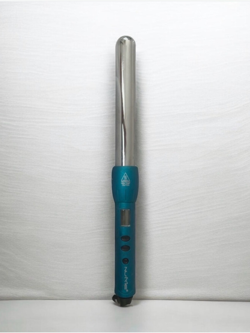 Authentic NuMe digital curling wand in teal.